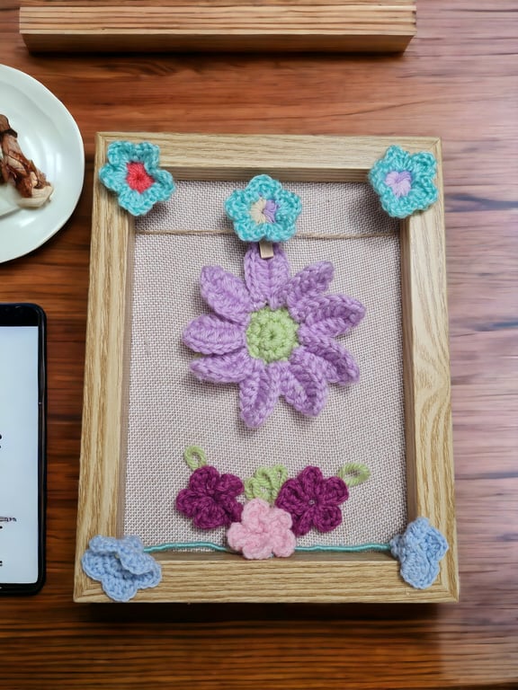 wood frame decorated with crochet flowers 