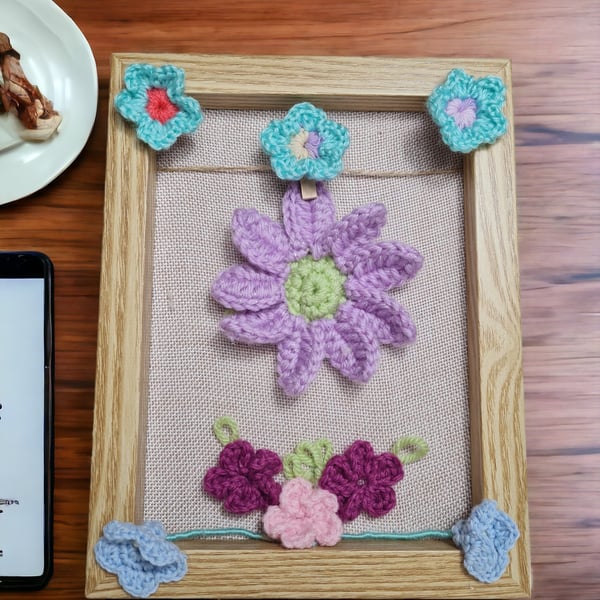 wood frame decorated with crochet flowers 