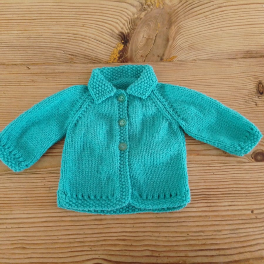 turquoise blue baby cardigan with collar aged 0-3 months.