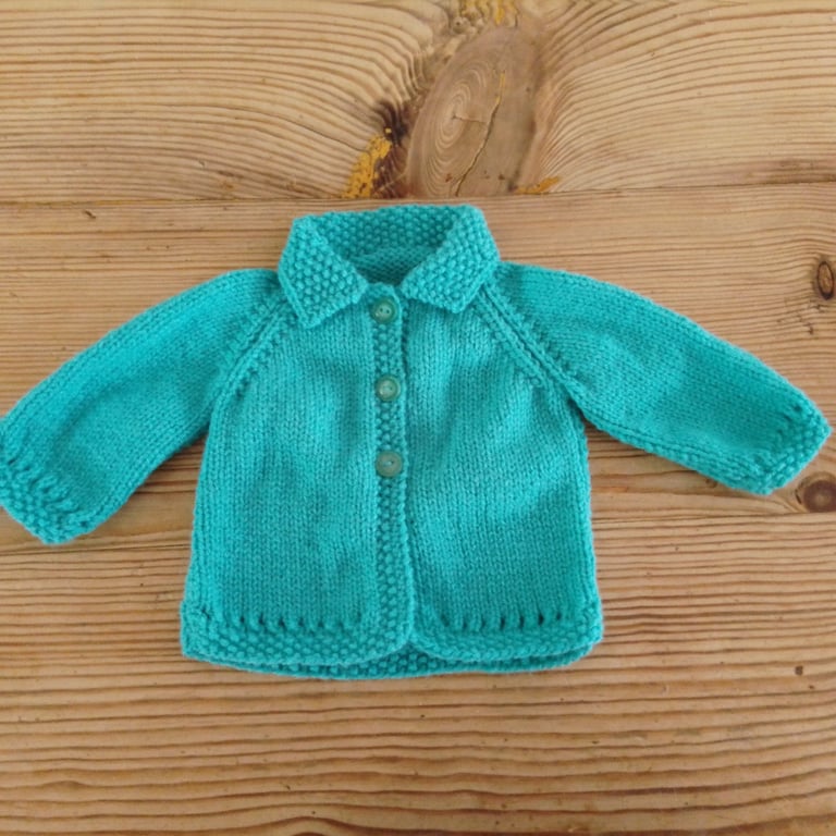 turquoise blue baby cardigan with collar aged 0-3 months.