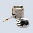 White and black marbled jewellery box with star details and flat lid