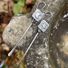 Silver long dangly mismatched earrings with star and moon