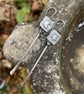 Silver long dangly mismatched earrings with star and moon