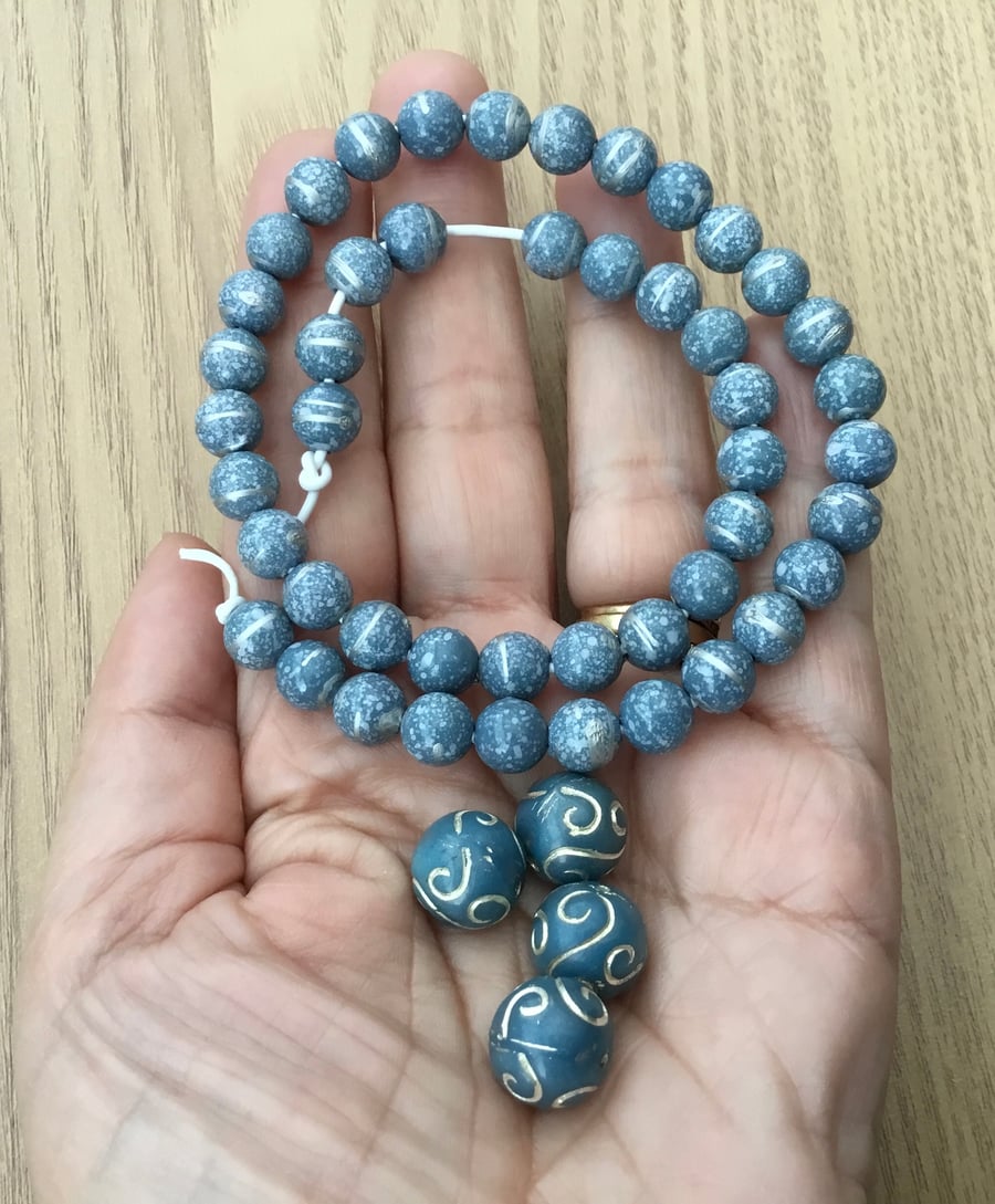 Pretty Collection of Denim Toned Composite Beads with Silver Swirls and Scrolls.