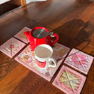 Set of Handmade Quilted Coasters – Biscuit Fabric, Mug Rugs, Pink Bind