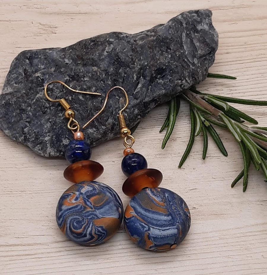 Polymer clay dangly disc earring with a hint of sparkle