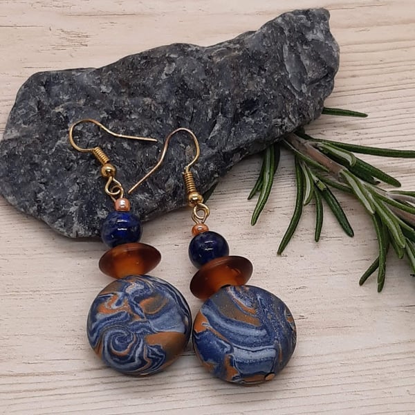 Polymer clay dangly disc earring with a hint of sparkle