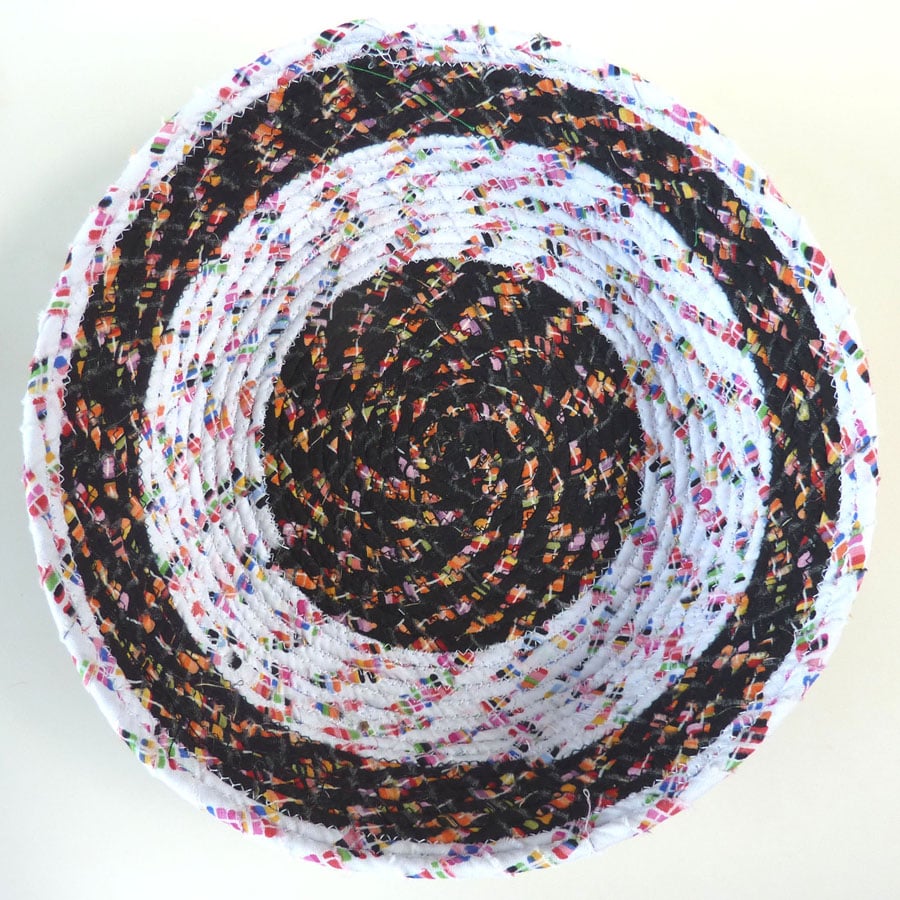 Shallow black and white coiled basket