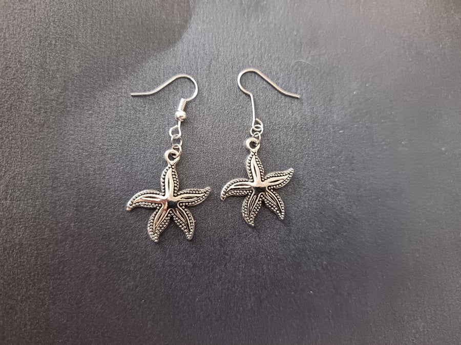 Silver starfish charm dangle earrings 