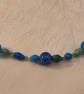 Blue & green paper and glass beaded necklace with blue accent beads