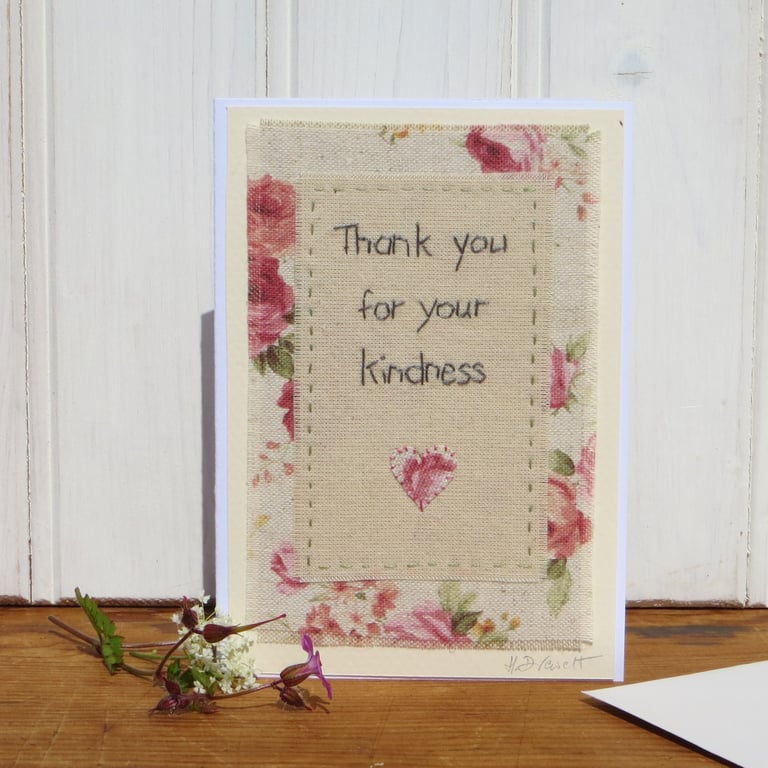 Hand-stitched words, pretty floral  fabric and applique heart