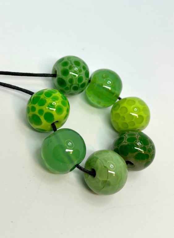 Handmade green spotty patterned lamp work glass beads