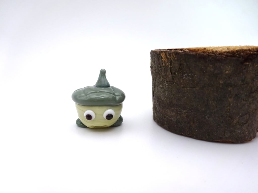 small glass acorn