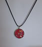 Handmade red glitter pendant on black waxed cord - Image 1