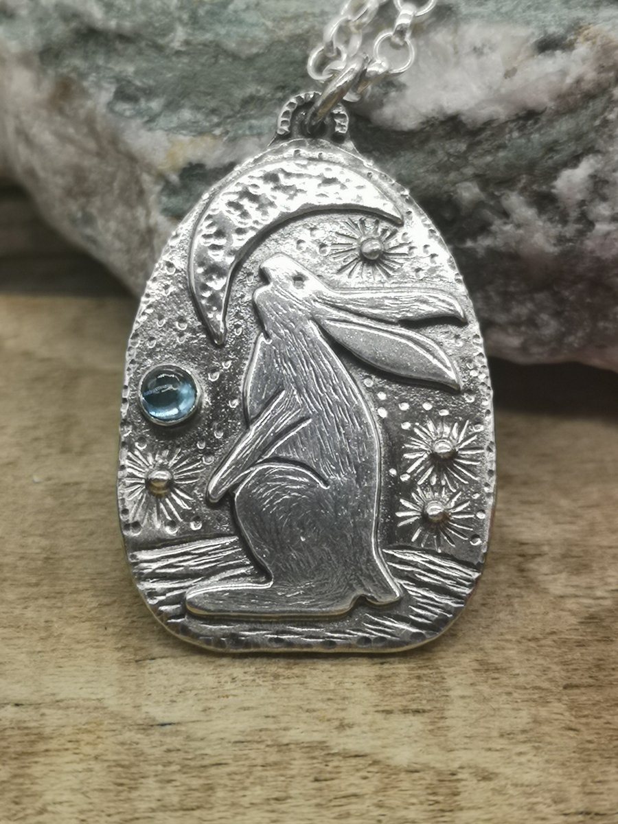Gazing at the Heavens Hare Pendant with blue topaz