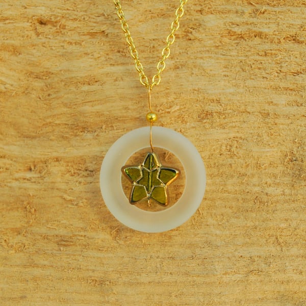 Frosty glass ring pendant with olive star