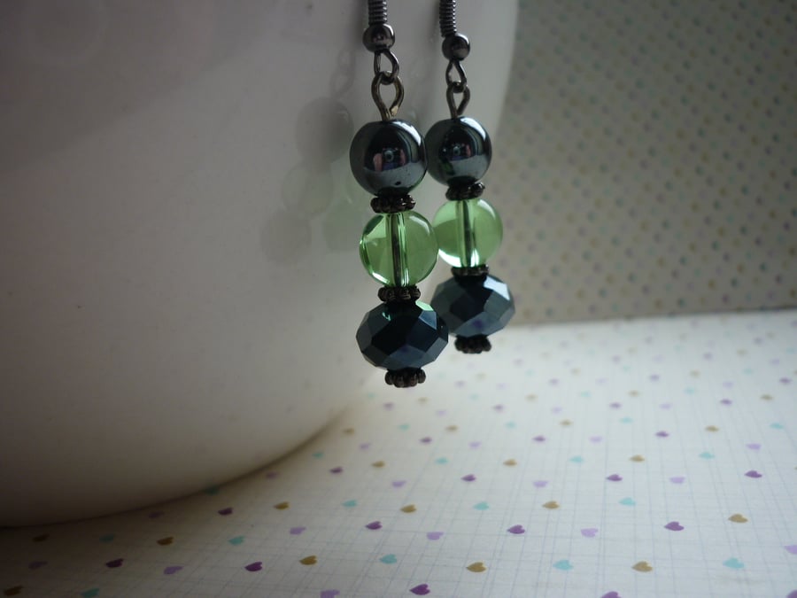 HEMATITE AND PALE GREEN EARRINGS.  748