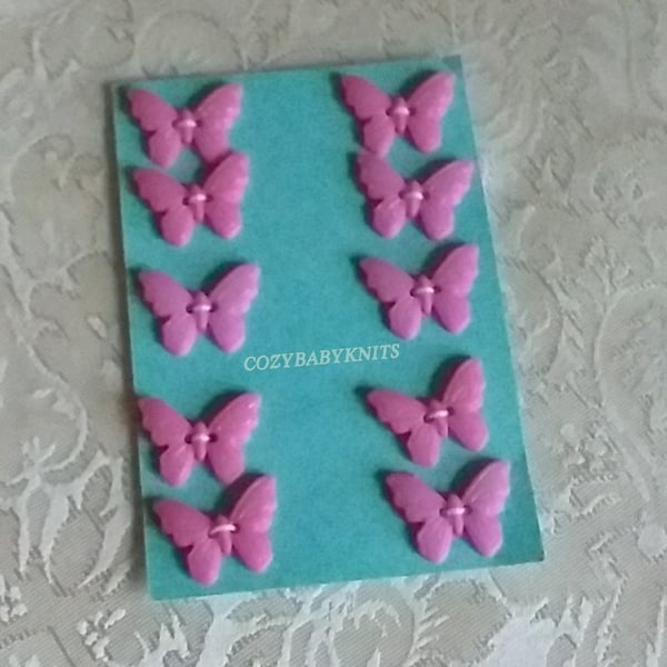 Pale pink butterfly plastic buttons