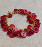 Red button bracelet with gold chain and toggle clasp  - Image 7