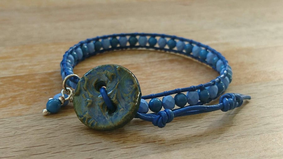 Blue leather and bead bracelet with ceramic button