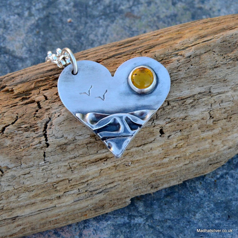 Silver heart shaped beach pendant with amber sun and seagulls
