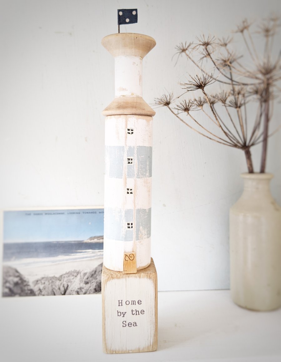 SALE- Wooden lighthouse with vintage bobbin and flag 'Home by the Sea'