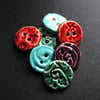 set of six small ceramic buttons