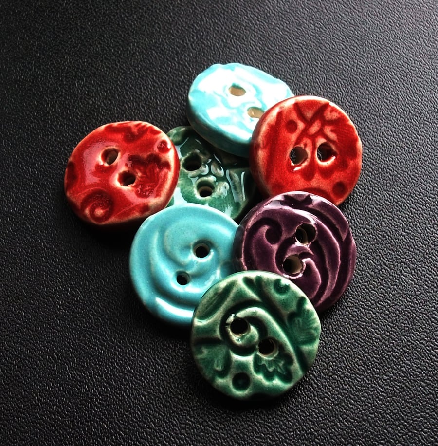 set of seven small ceramic buttons