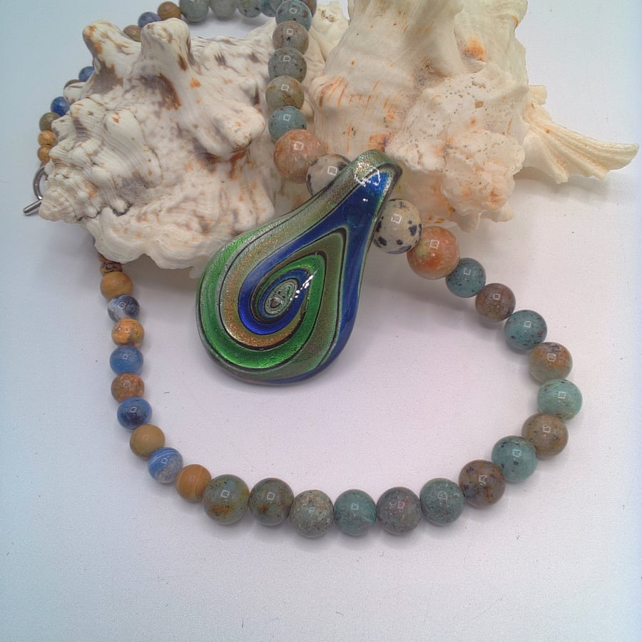Glass Pendant with Blue Green and Gold Swirls on a Mixed Gemstone Necklace