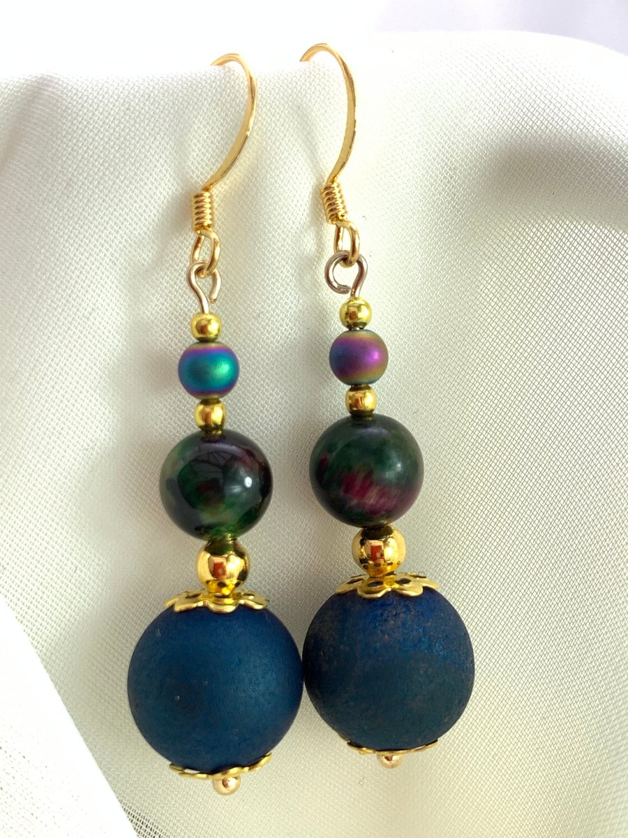 Pair of earrings with blue agate, pink green tiger's eye, and rainbow hematite