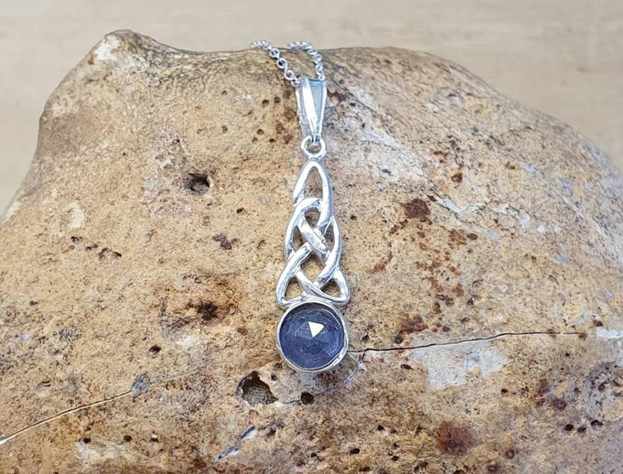 Tiny Tanzanite celtic knot pendant. December birthstone.