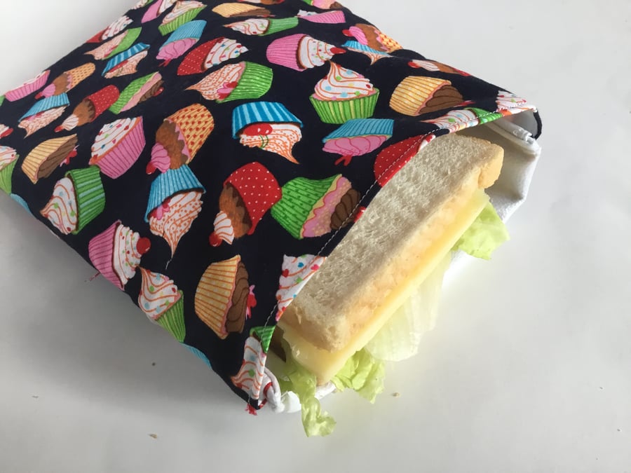 Large, re-usable, eco-friendly sandwich bag in cupcake fabric with PUL lining.