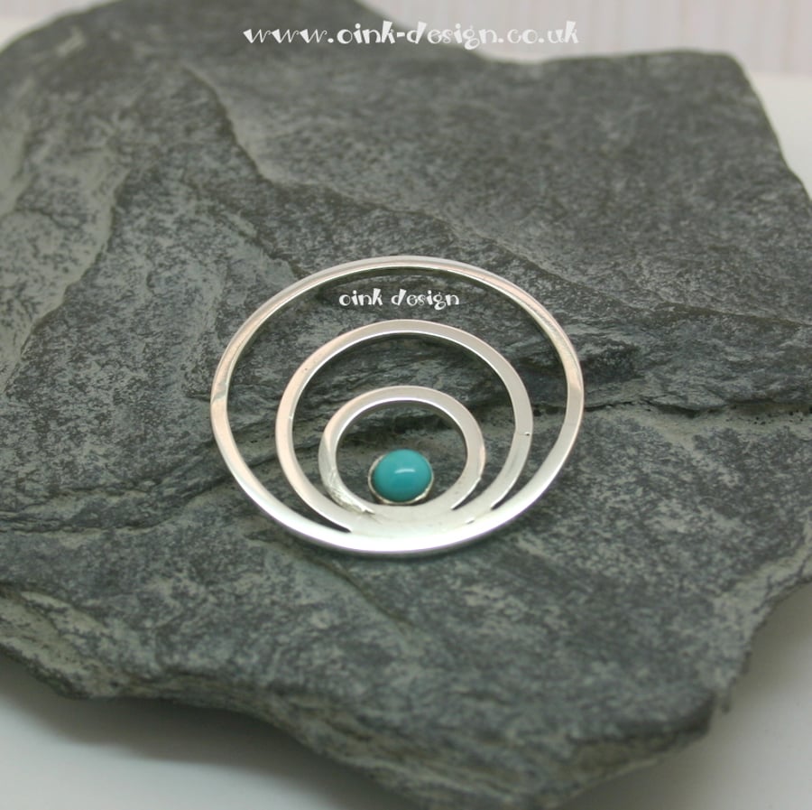 Sterling Silver circles with a Turquoise stone pendant