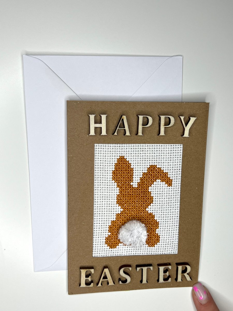 Happy Easter orange bunny with pompon