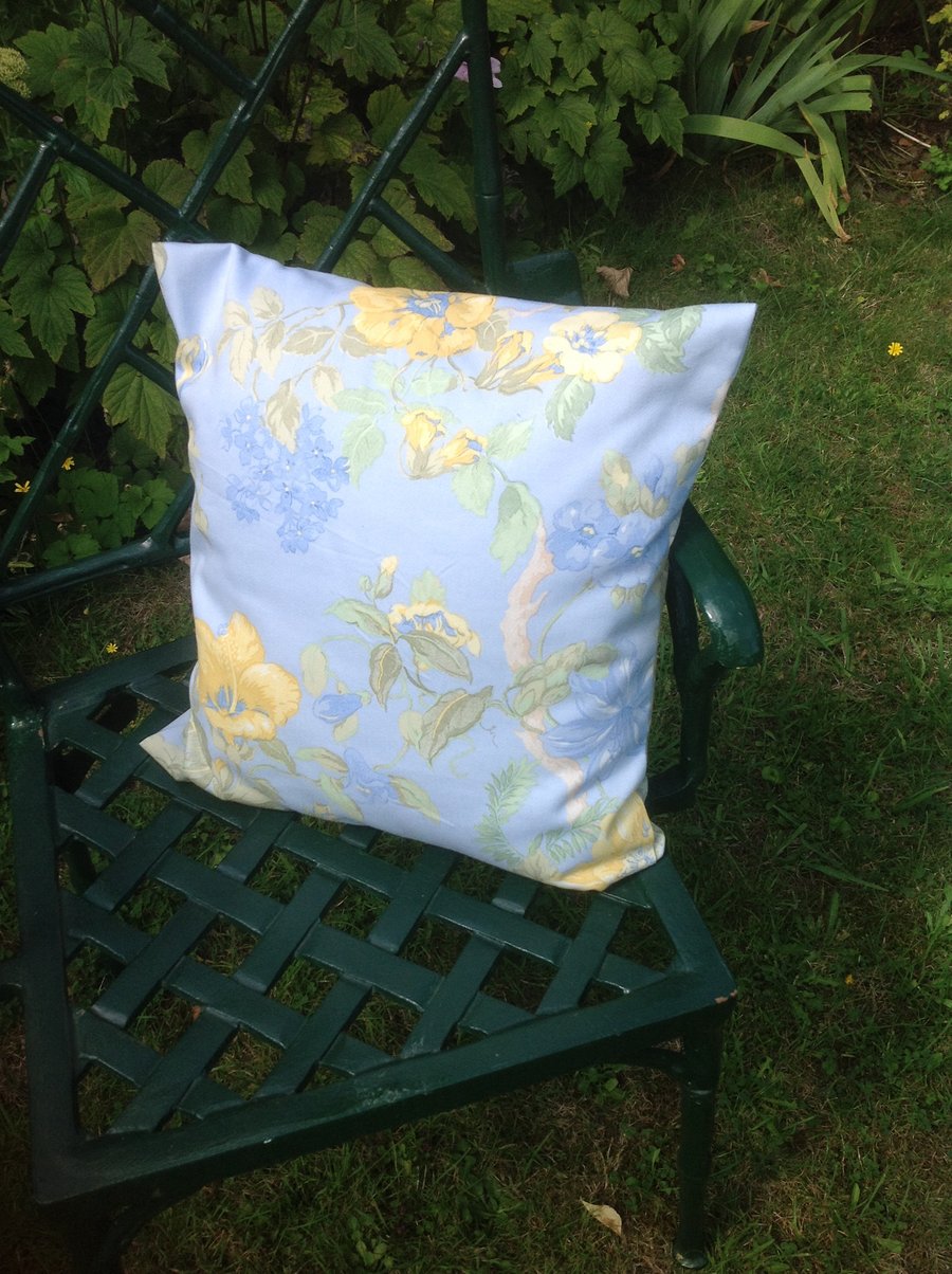 Blue and yellow floral cushion