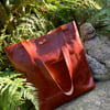 Handmade leather unisex chestnut brown tote bag. Versatile and stylish.