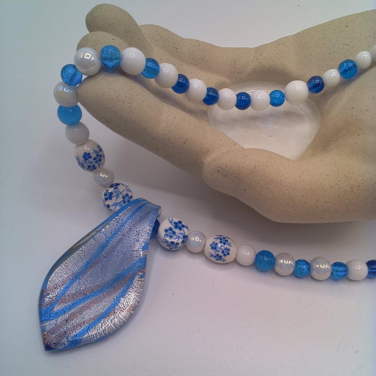 Blue Patterned Teardrop Glass Pendant on a Blue and White Beaded Necklace