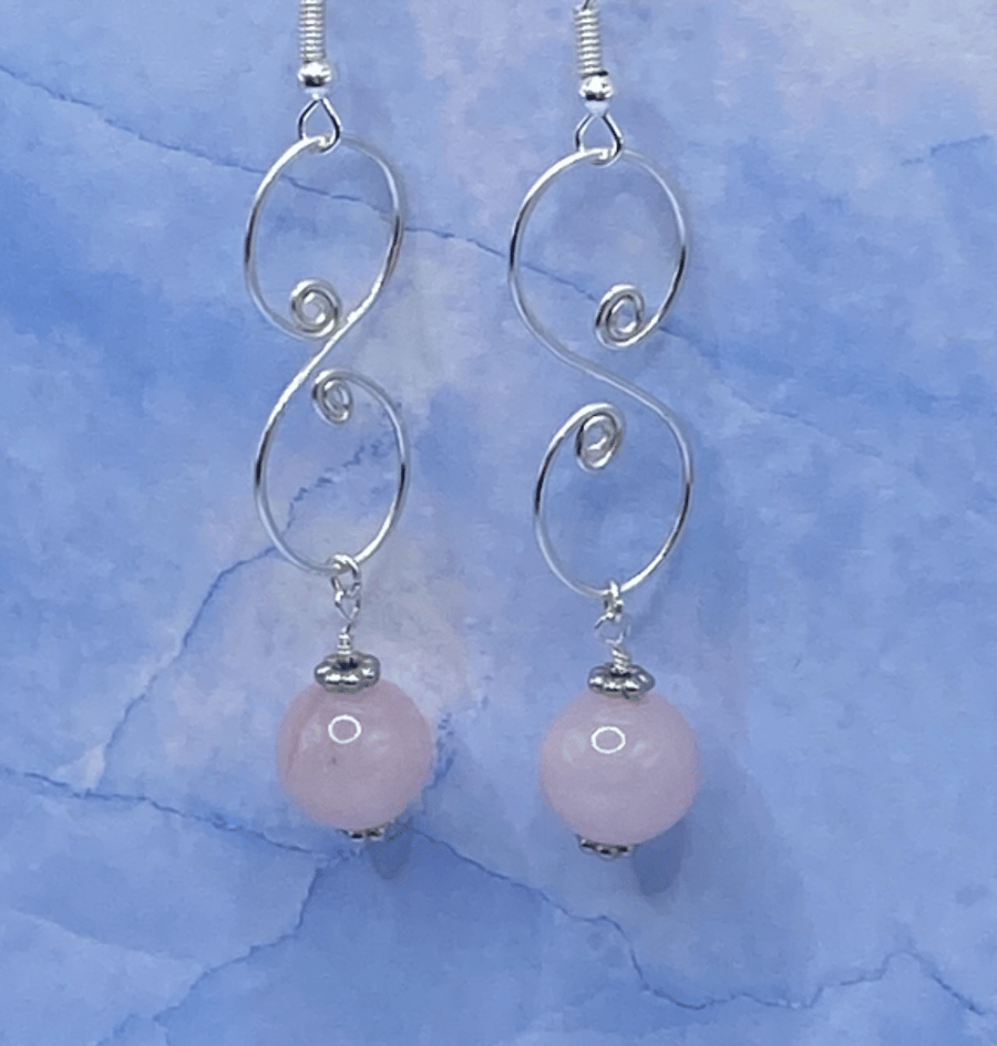 Drop earrings with wirework spirals and rose quartz stones
