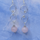 Drop earrings with wirework spirals and rose quartz stones