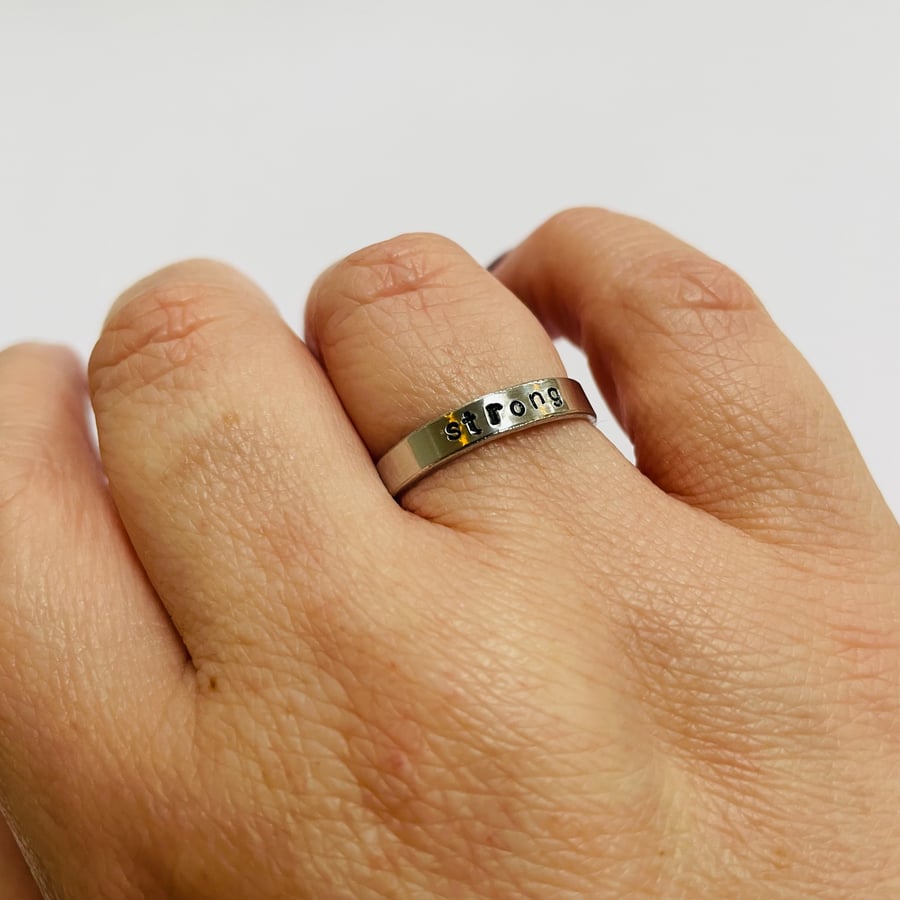 Stamped ring with hidden swear word