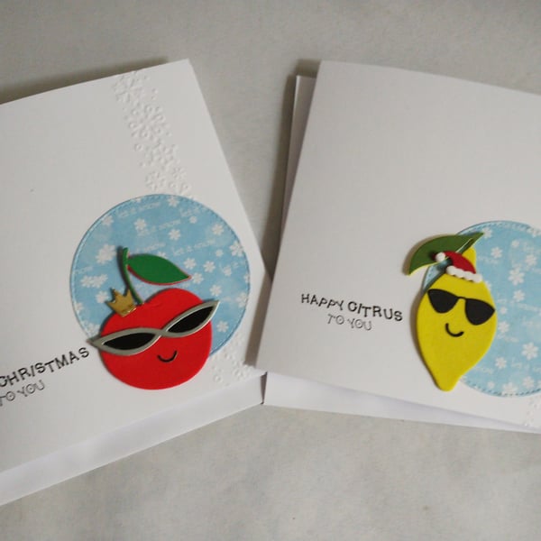 A pair of Punny Fruity Christmas Cards - Happy Citrus - Berry Christmas 