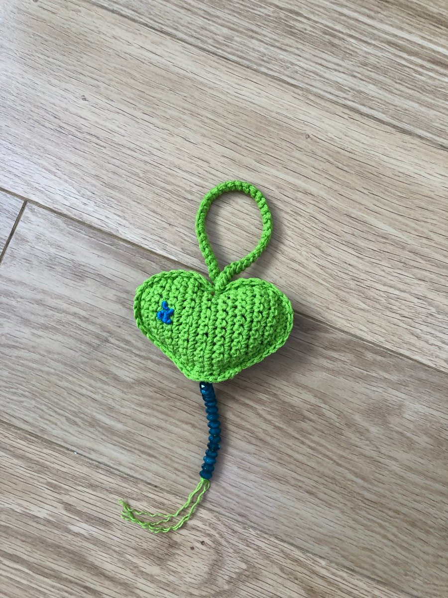 Green padded handmade crochet hanging heart with embroidery…..