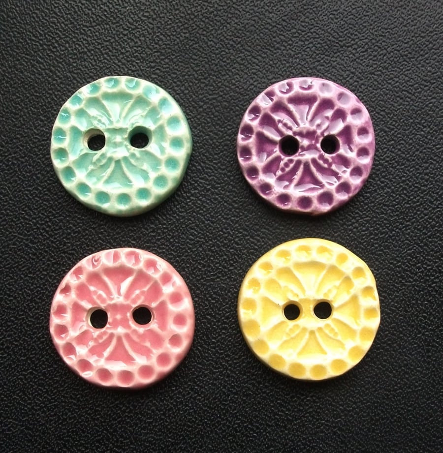 Set of four little handmade ceramic buttons