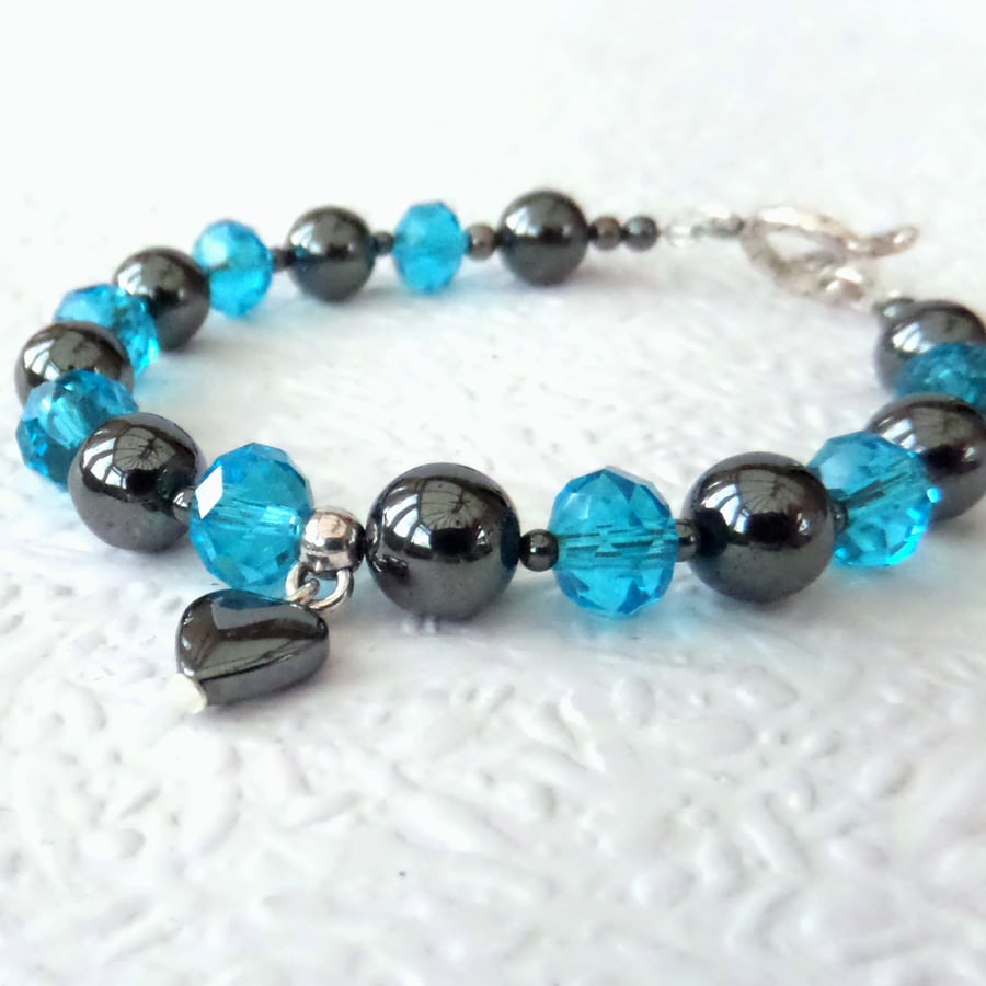 Handmade hematite and blue crystal bracelet, with hematite heart embelishment