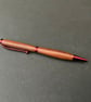 Slimline twist ballpoint pen made with milk pear hardwood and red fittings - Image 2