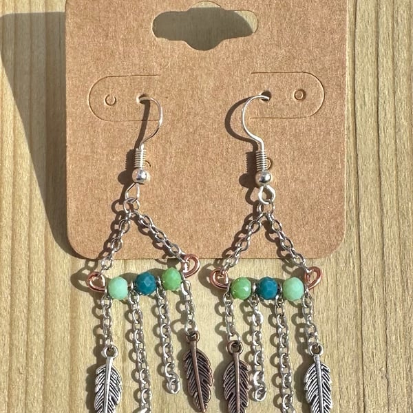 Boho style green, silver and bronze dangle earrings with feather charms