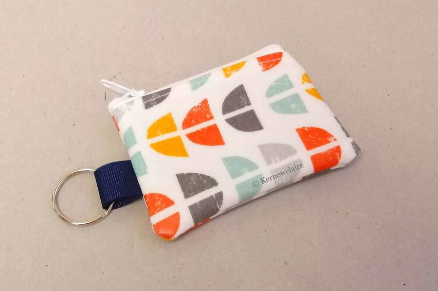 Mini coin purse key ring in white, orange and aqua