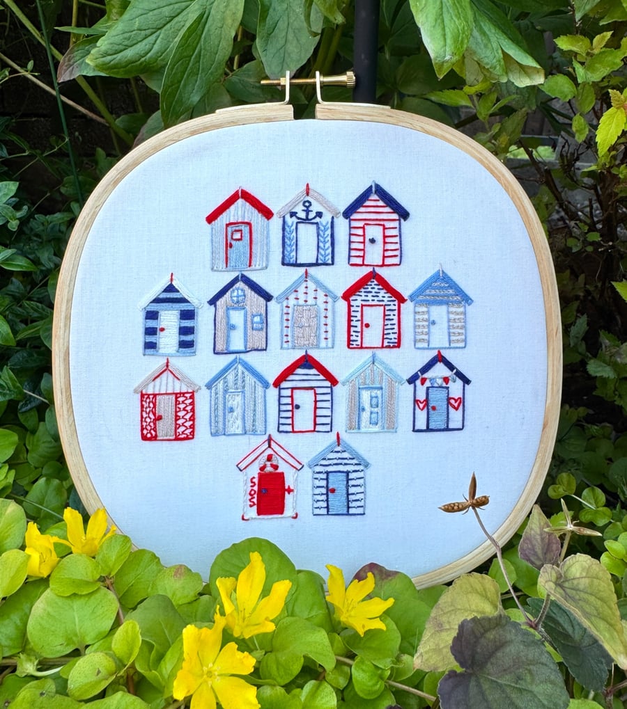 An embroidered gift, a seaside escape, beach huts framed  artwork 