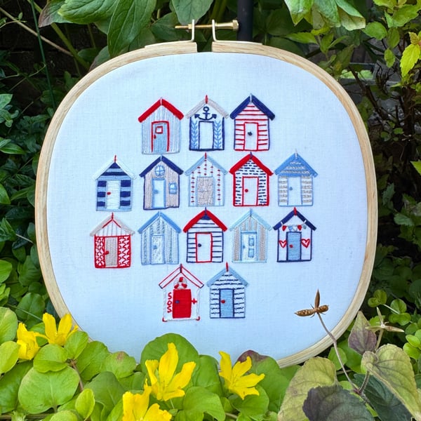 An embroidered gift, a seaside escape, beach huts framed  artwork 