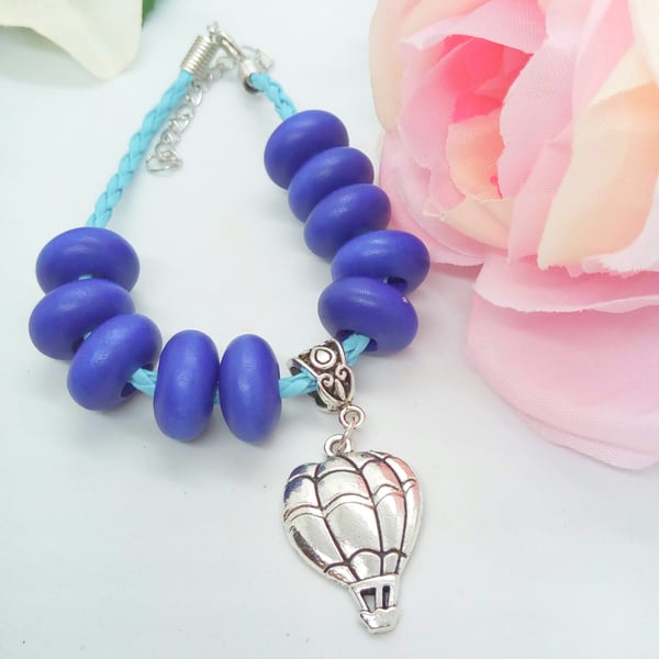 Blue Plaited Leather Bracelet with Blue Wooden Beads and a Silver Balloon Charm